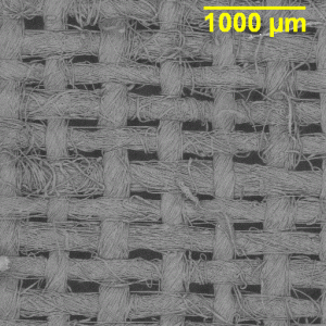 SEM image of low quality cotton fabric. Again the lower thread count per inch is obvious.