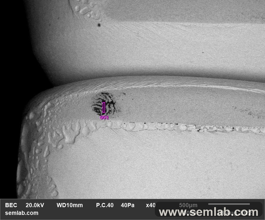 Localized flux residue on a tin-plated lug surface
