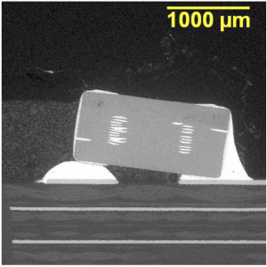 BSE SEM image of a microsection of the device as soldered on the PCBA.