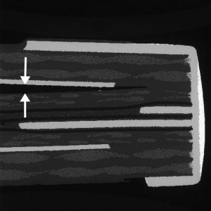 Delamination of PWB due to improper oxide treatment prior to lamination.