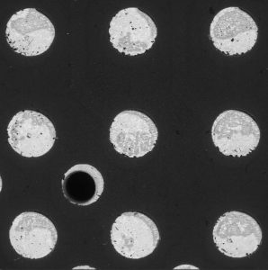 Hot air solder leveled PWB shows exposed Cu-Sn intermetallic compound. This caused severe wetting problems during assembly.