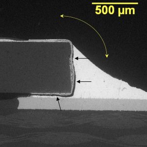 Thick film resistor solder joint that failed in brittle fracture mode at the interface between the solder and the Ni-barrier plating
